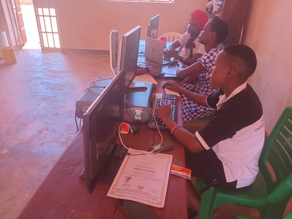 Students learning computer skills in a lab